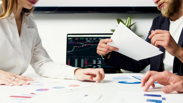 man and woman doing paperwork