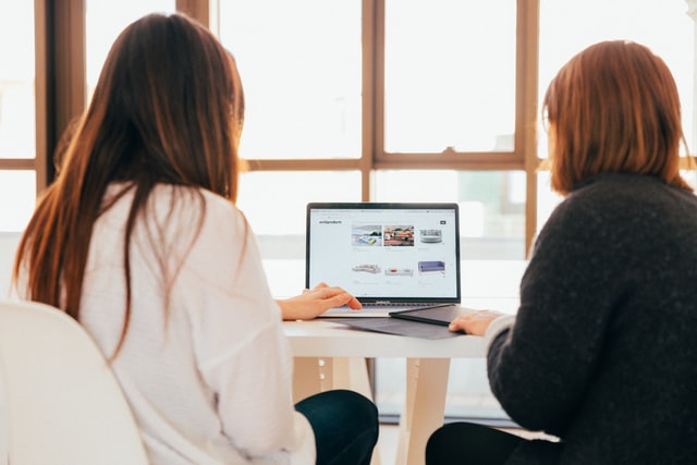 two women online shopping for furniture