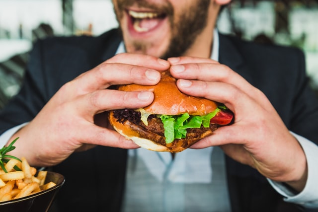 man holding a burger